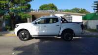 Nissan NP300 Frontier 2023 4p Platinum LE L4/2.5 Aut 2023 Nissan NP300 Frontier Ingreso Exteriores 7